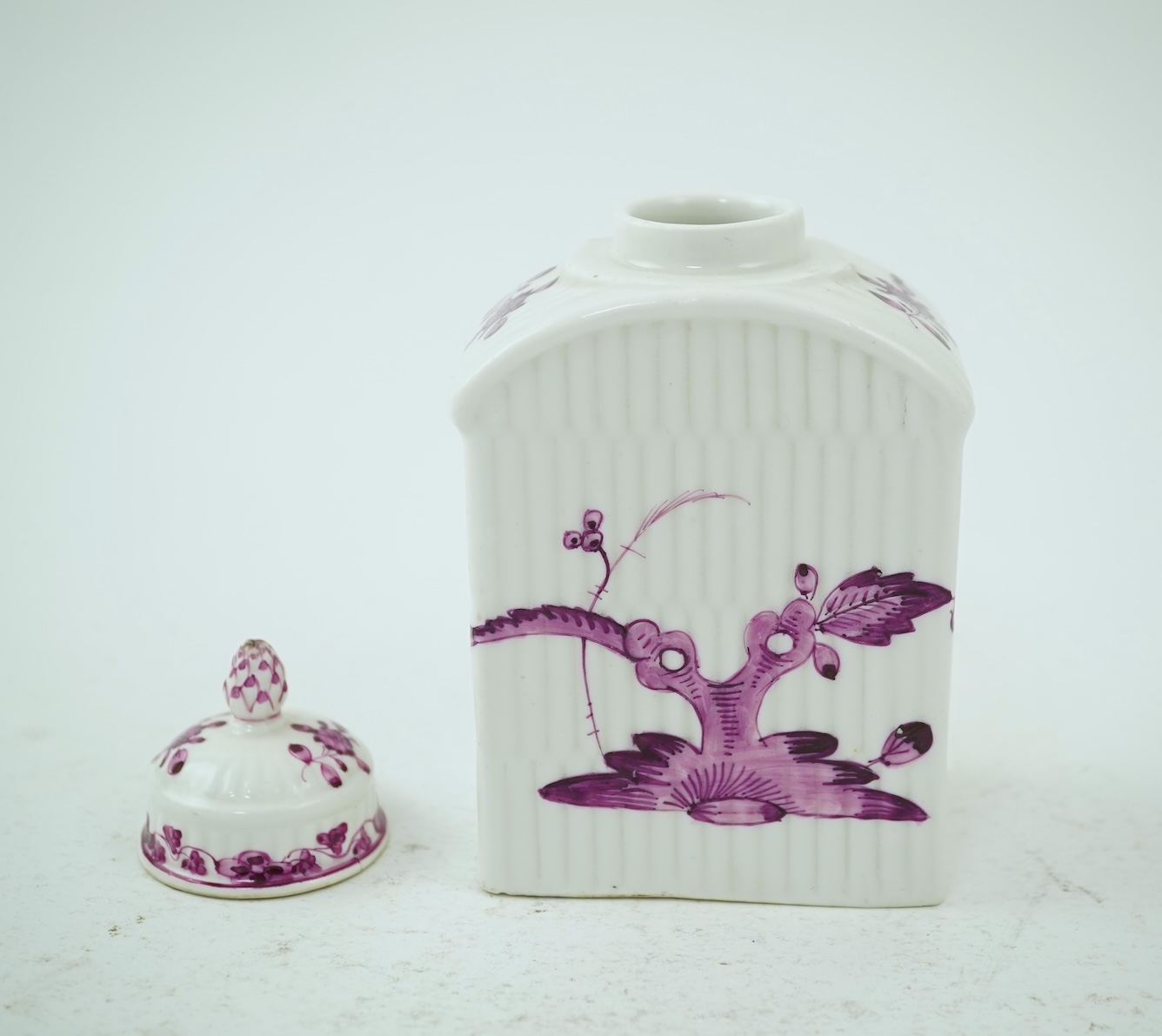 A Meissen puce painted tea caddy and cover, late 18th century